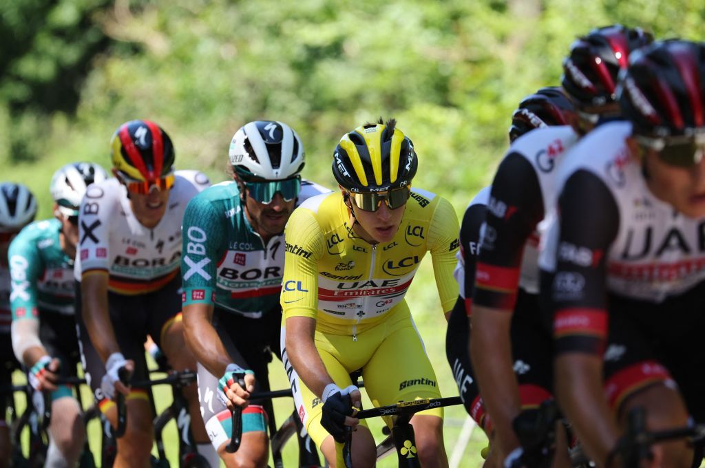UAE Team Emirates teams Slovenian rider Tadej Pogacar wearing the overall leaders yellow jersey cycles with the pack of riders during the 7th stage of the 109th edition of the Tour de France cycling race 1763 km between Tomblaine and La Super Planche des Belles Filles in eastern France on July 8 2022 Photo by Thomas SAMSON AFP Photo by THOMAS SAMSONAFP via Getty Images