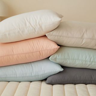 Whipped Cream Tencel Modal Pillow Cases on a bed.