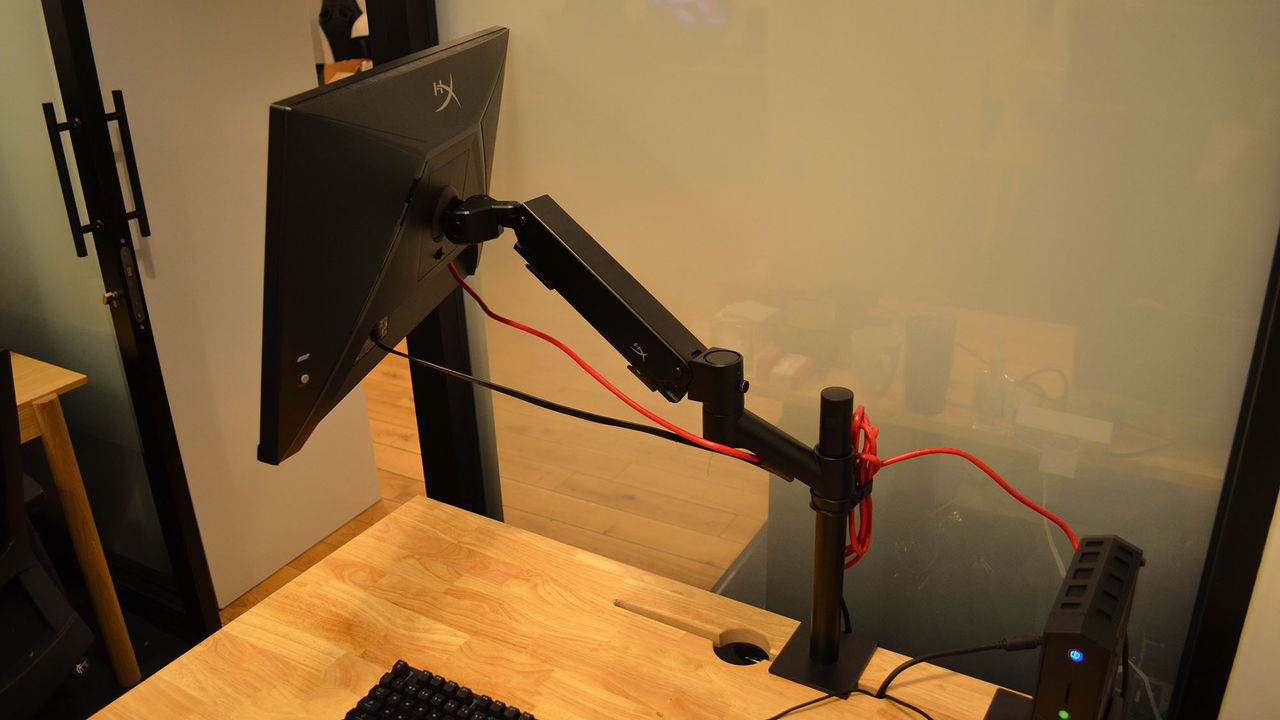 A HyperX Armada 27 on a wooden desk