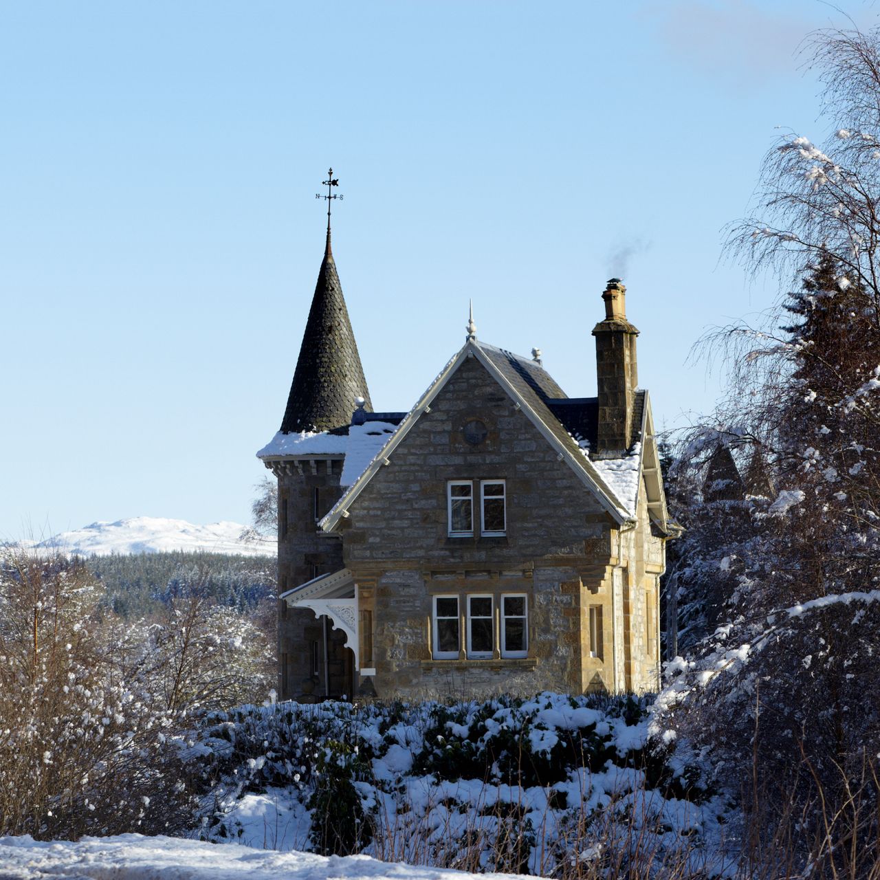 gothic revival style house with turret and porch