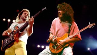 Rock musicians Michael Anthony and Eddie Van Halen (1955 - 2020), both of the group Van Halen, perform onstage.