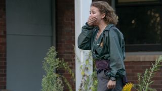 Millicent Simmonds holding her hand over her mouth in A Quiet Place Part II