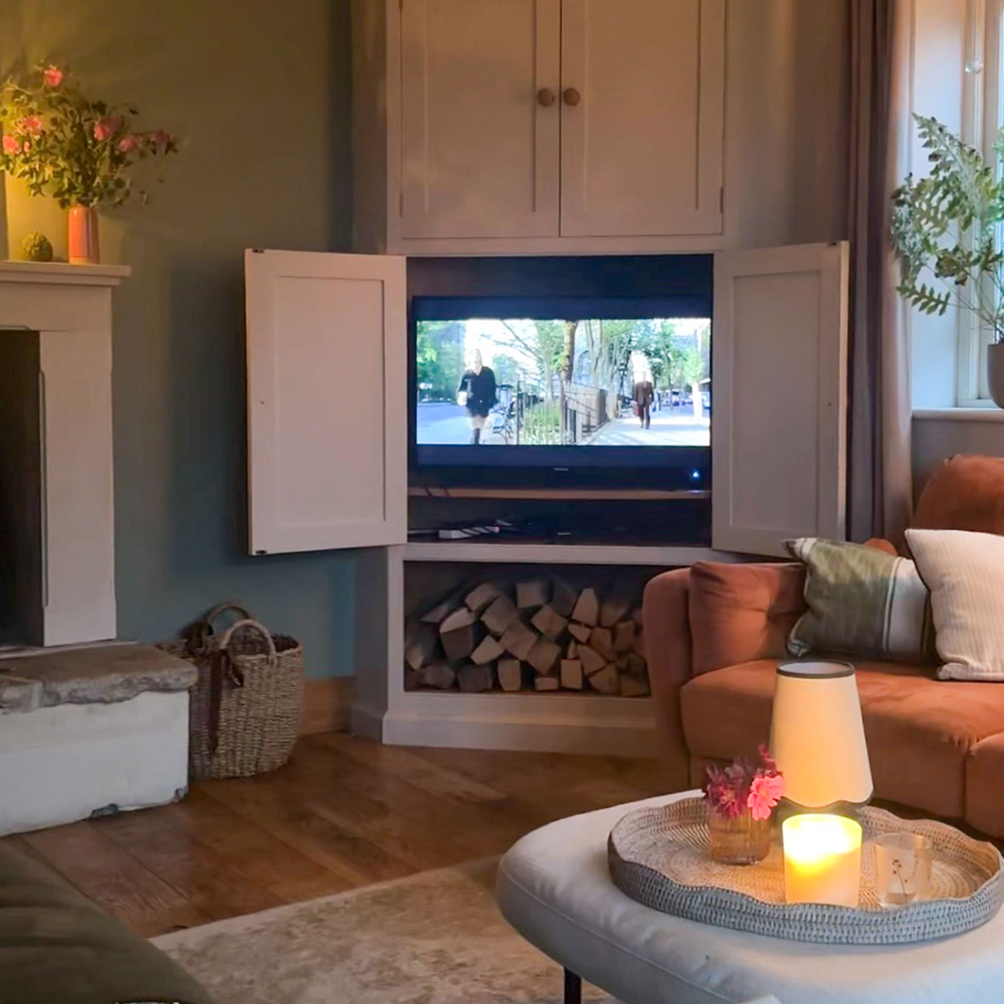 Switched on TV in corner of room