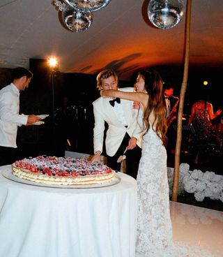 Millie Bobby Brown and Jake Bongiovi cutting their wedding cake