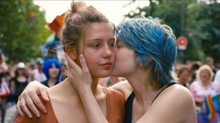 Adèle Exarchopoulos as Adèle is kissed on the cheek by Léa Seydoux as Emma in Blue Is the Warmest Color