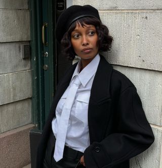 Woman with a French curly bob haircut