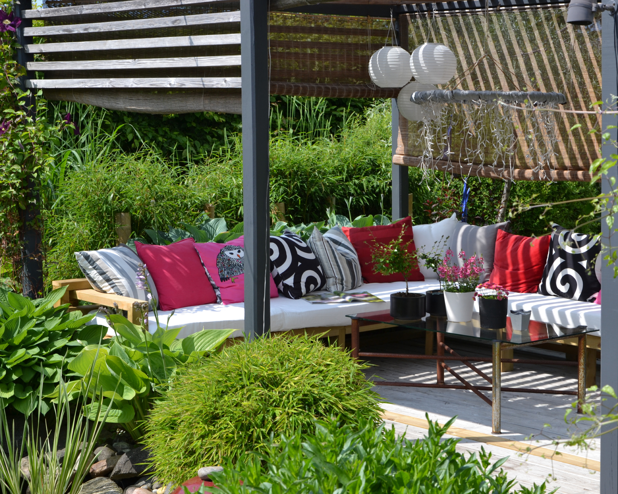 outdoor sofa in covered pergola with a canopy