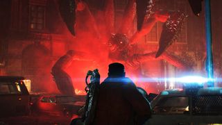 A lone armed figure faces a gigantic, many-limbed creature in a red-lit city street, with wrecked cars and a blue beam creating a tense, ominous scene.