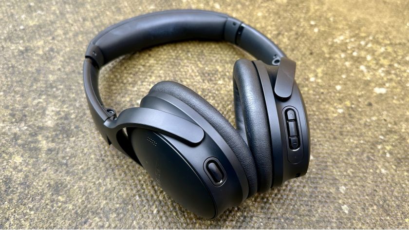 The Bose Quietcomfort over-ear headphones pictured on concrete