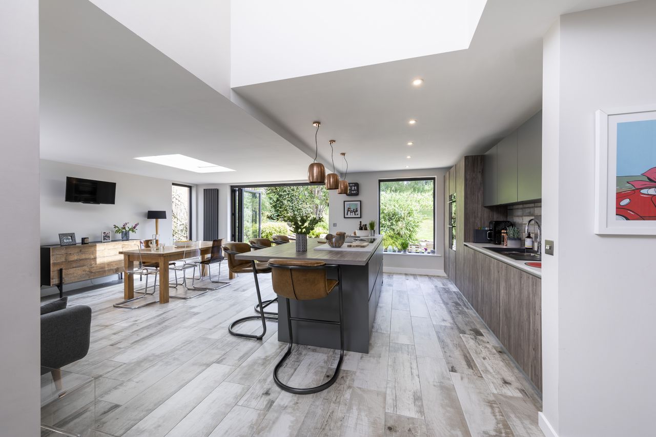 The extension has more than doubled the size of the original kitchen and a set of bifold doors now link the house and garden seamlessly.