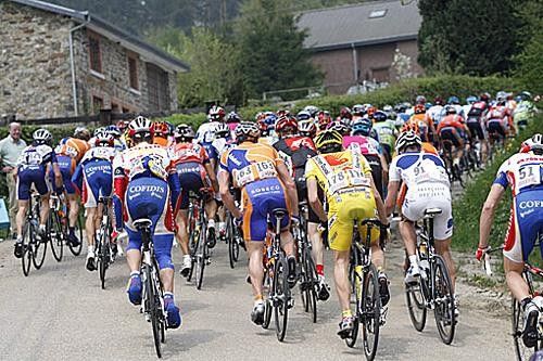 The peloton ascends another climb