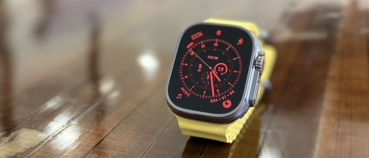 Apple Watch Ultra in use on wrist and on table