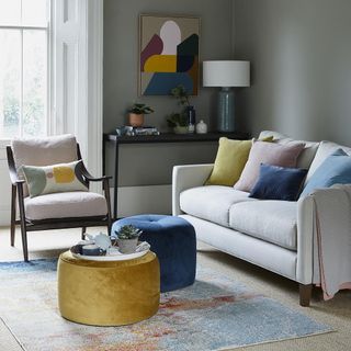 Living room with armchair and sofa set with cushion