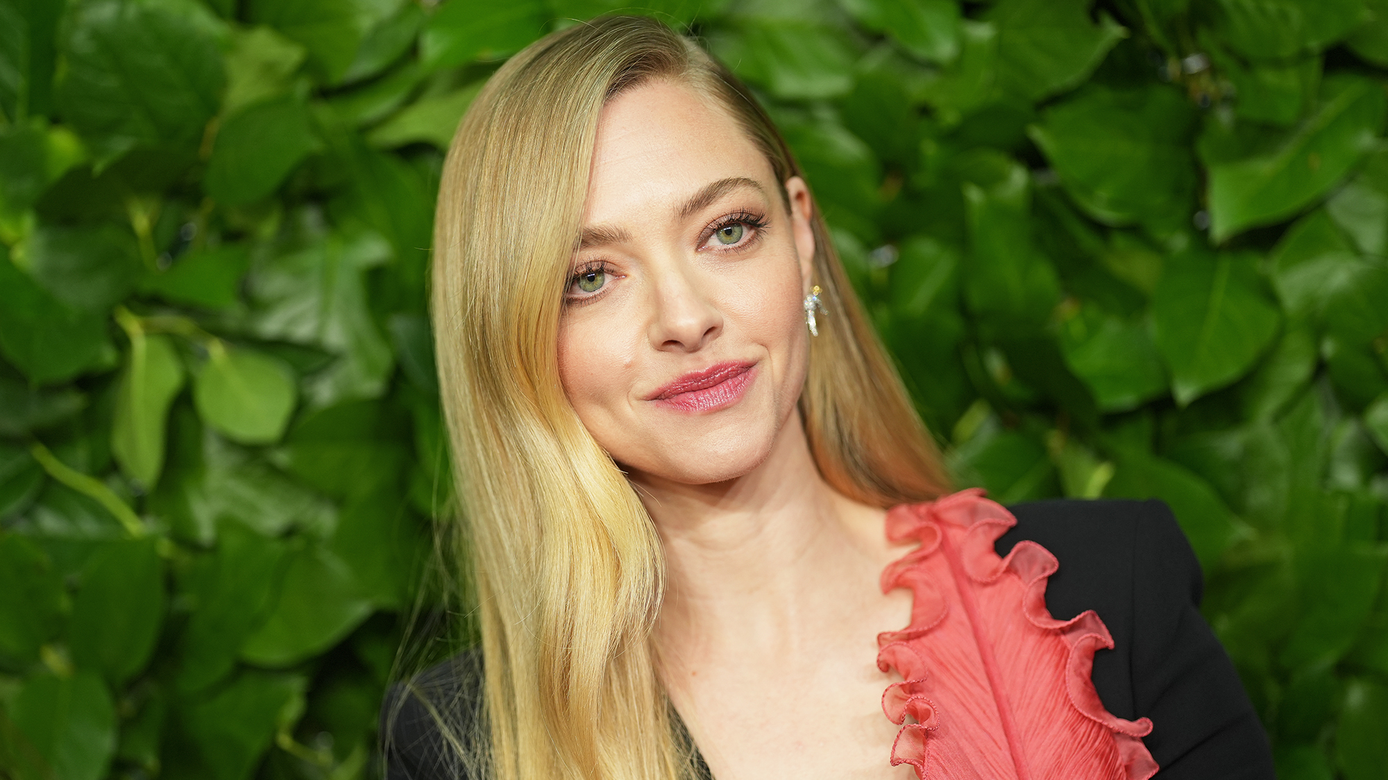 Amanda Seyfried at the 35th Annual Gotham Film Awards in front of leafy green background