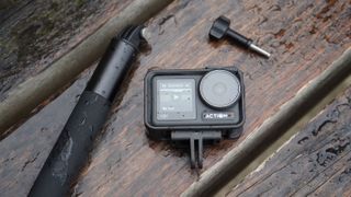 DJI Osmo Action 3 on a wet wooden background
