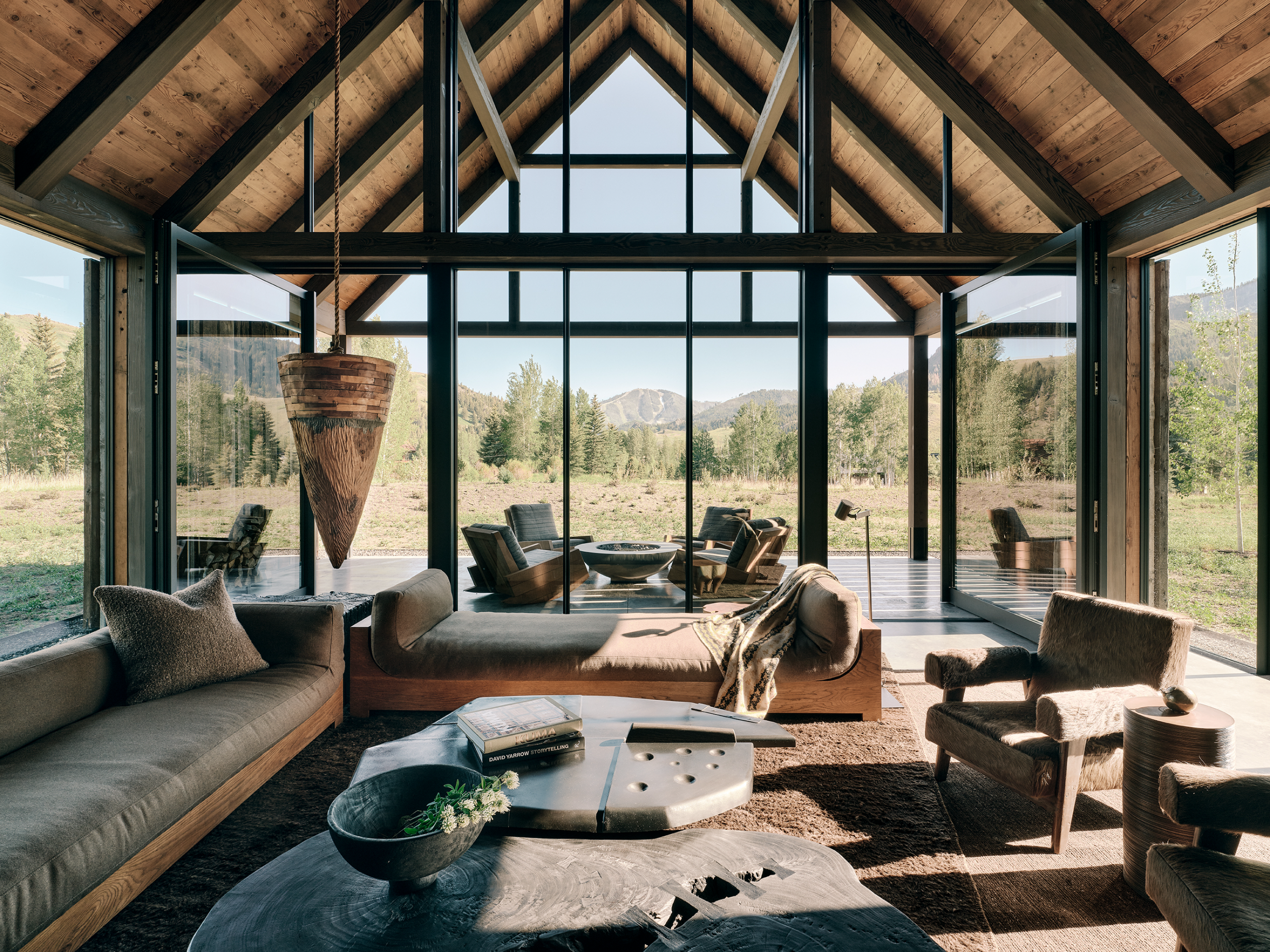 Three Barns by Field Architecture, a rural american home designed to look like a collection of old wooden barns