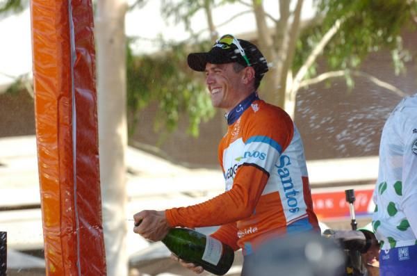 Savouring the moment: Simon Gerrans (GreenEdge) gets ready to spray the crowd.