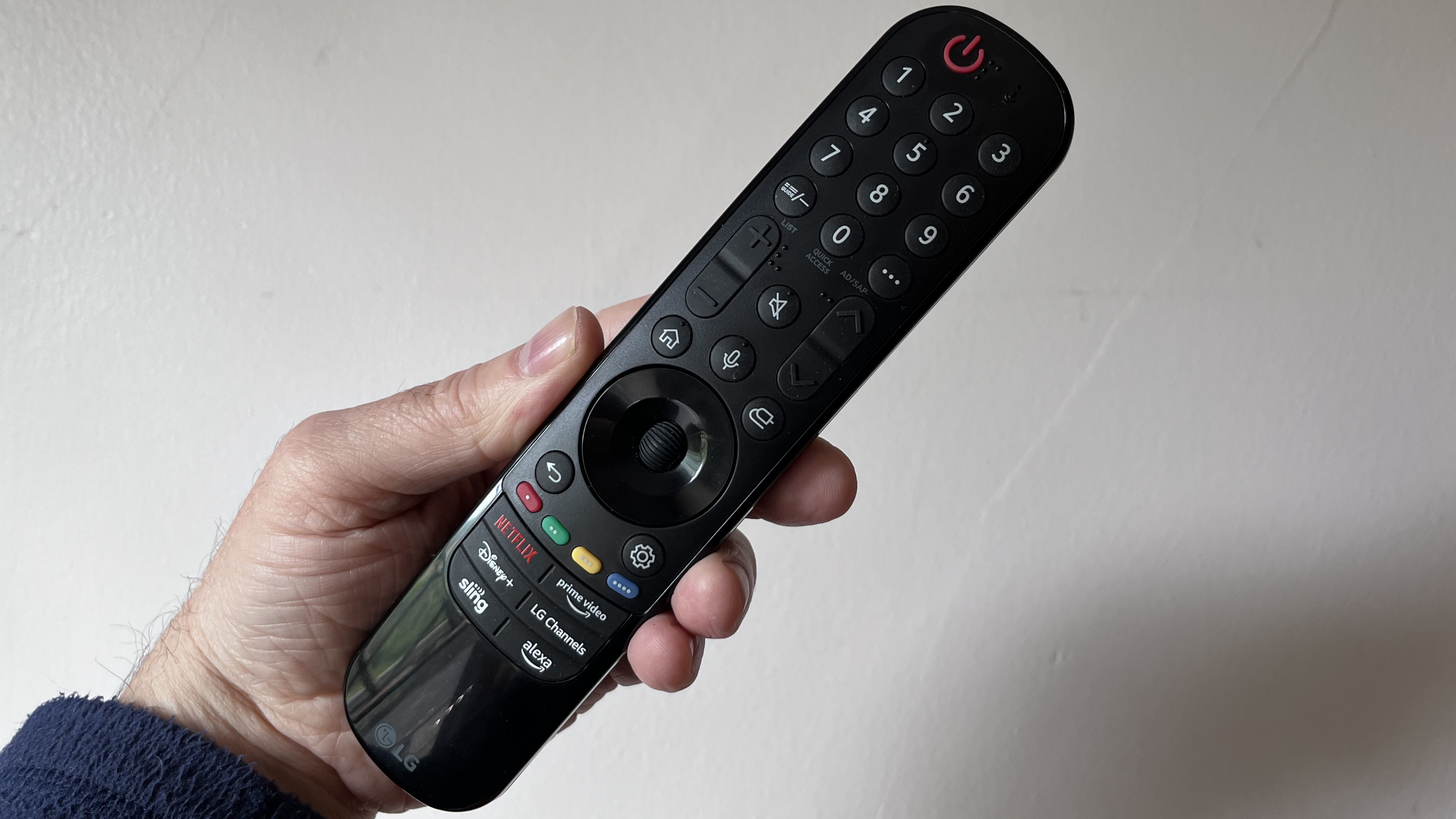 LG C4 OLED TV  remote control held in hand