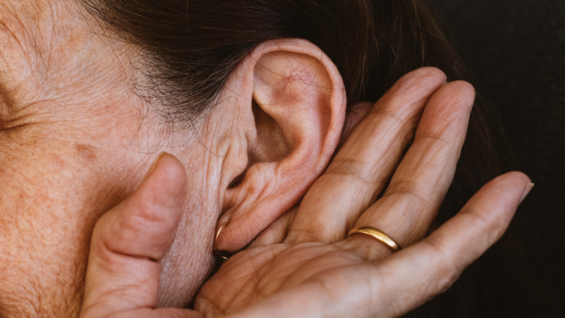 Woman listening out of her ear