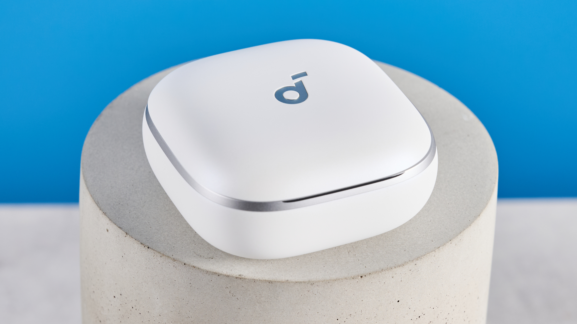 The Soundcore Liberty 5 photographed in front of a blue background.