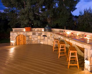 outdoor decking with kitchen at night
