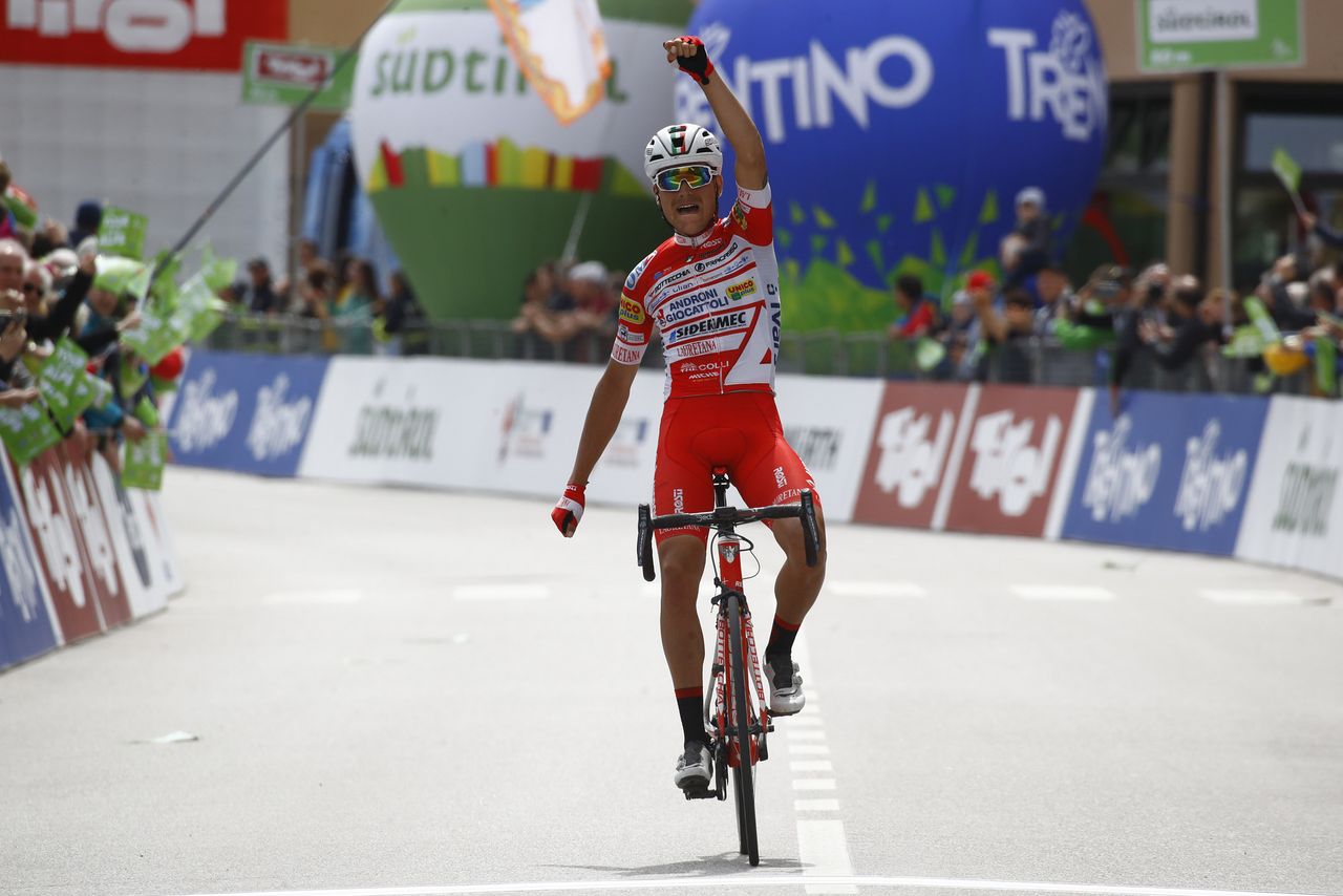 Fausto Masnada sits up and celebrates