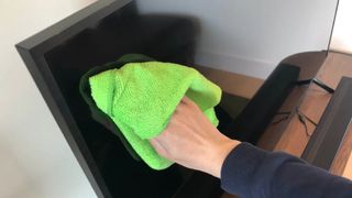 Cleaning TV with a microfiber cloth