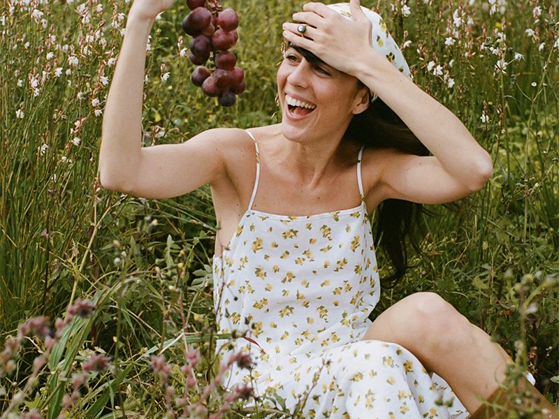 model wears ditsy, dainty floral slip dress.