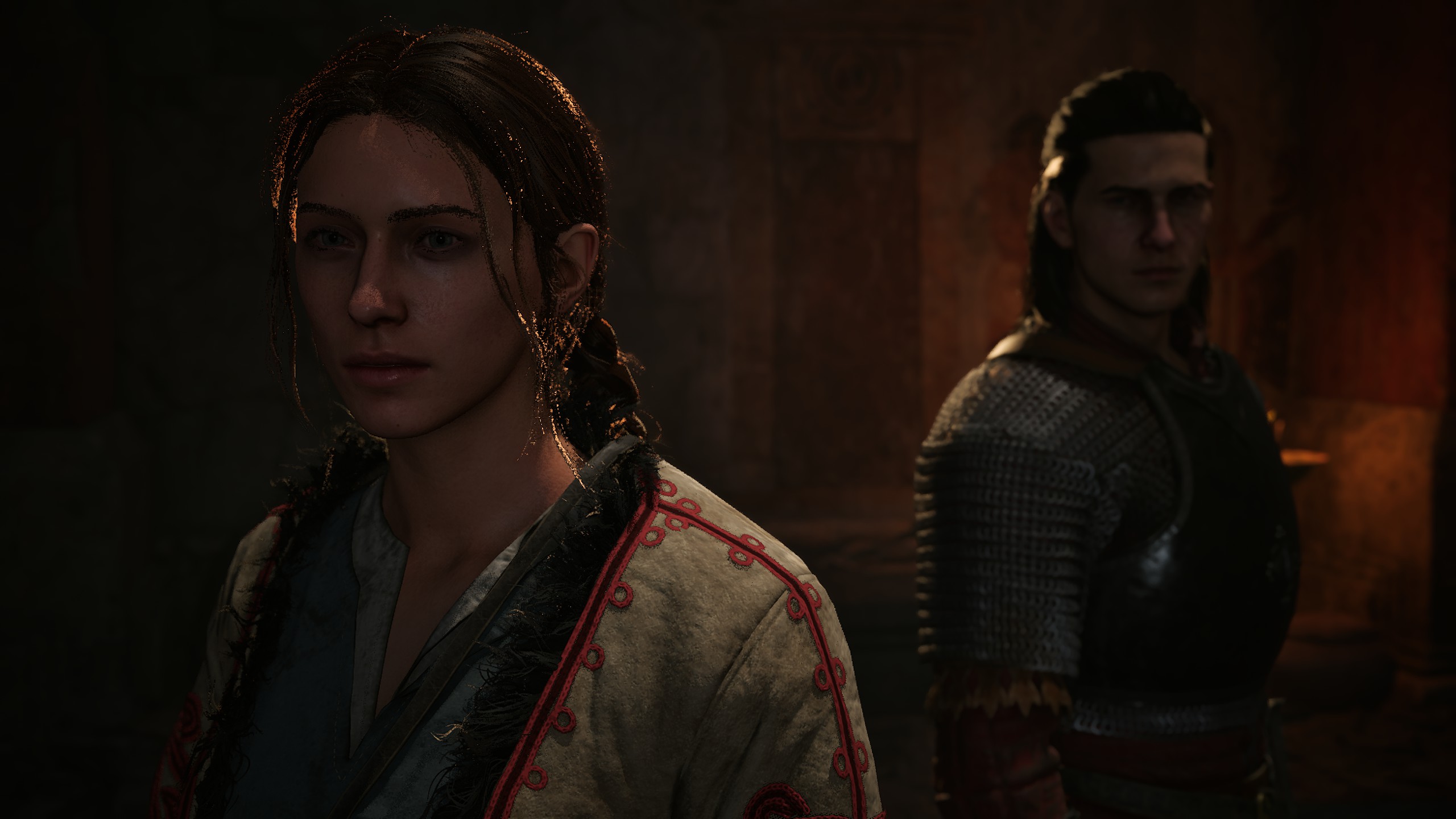 Two characters side by side in the dimly lit room