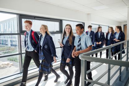 High school students walking to their next class.