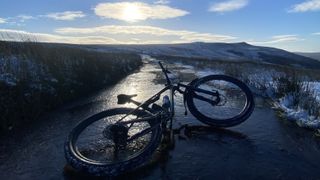 Mountain bike on icy puddle