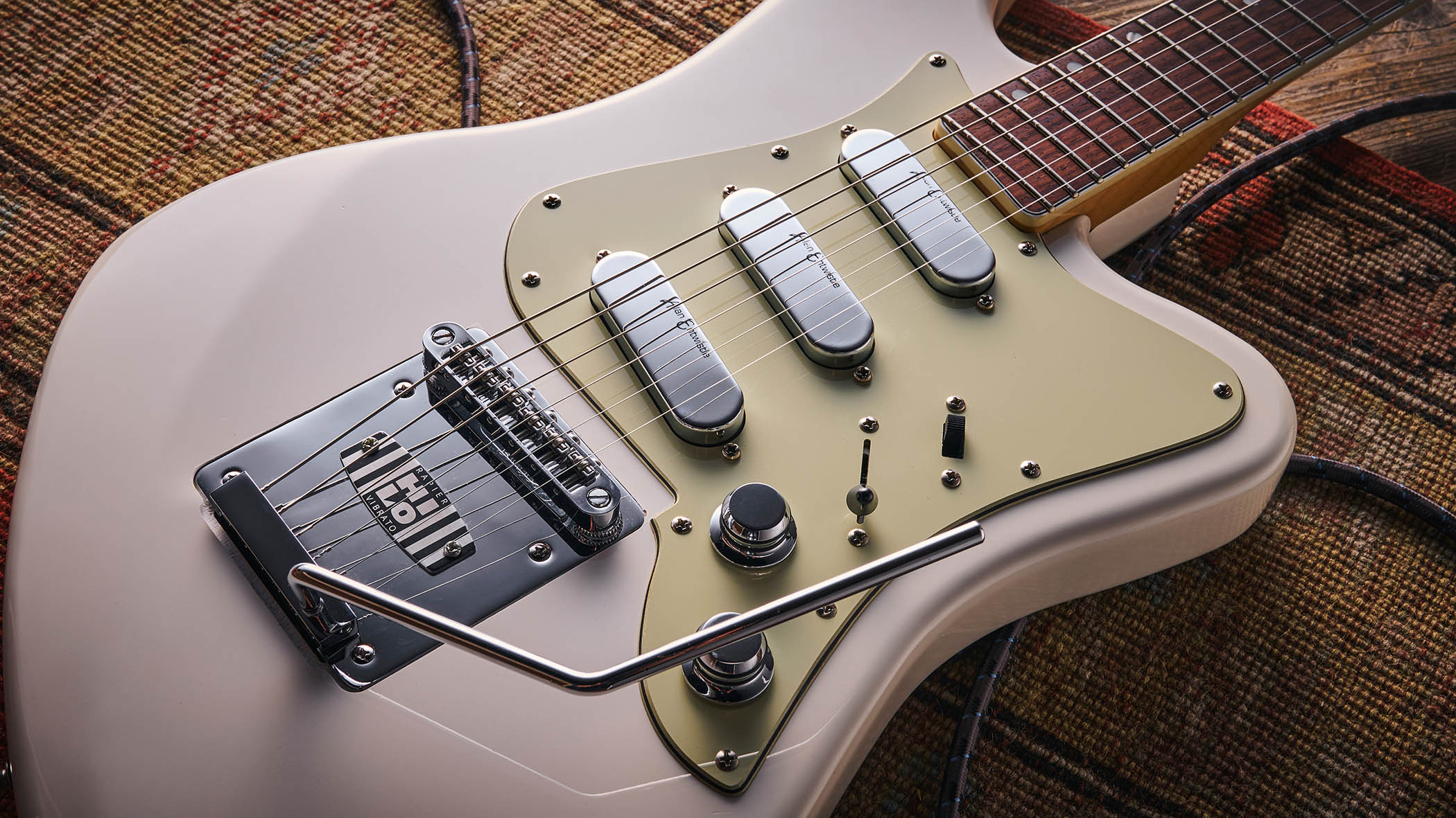 Vintage REVO Astrostar: the retro-inspired electric has three single-coils, a white finish with cream pickguard and is photographed in close-up.