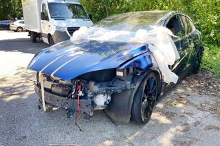 A totaled Tesla electric car