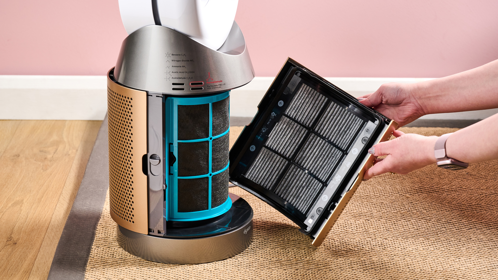 A woman is removing one half of the filter from the TP09.