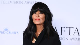 Claudia Winkleman is pictured with a full fringe and orange/red lipstick whilst attending the 2023 BAFTA Television Awards with P&O Cruises at The Royal Festival Hall on May 14, 2023 in London, England.