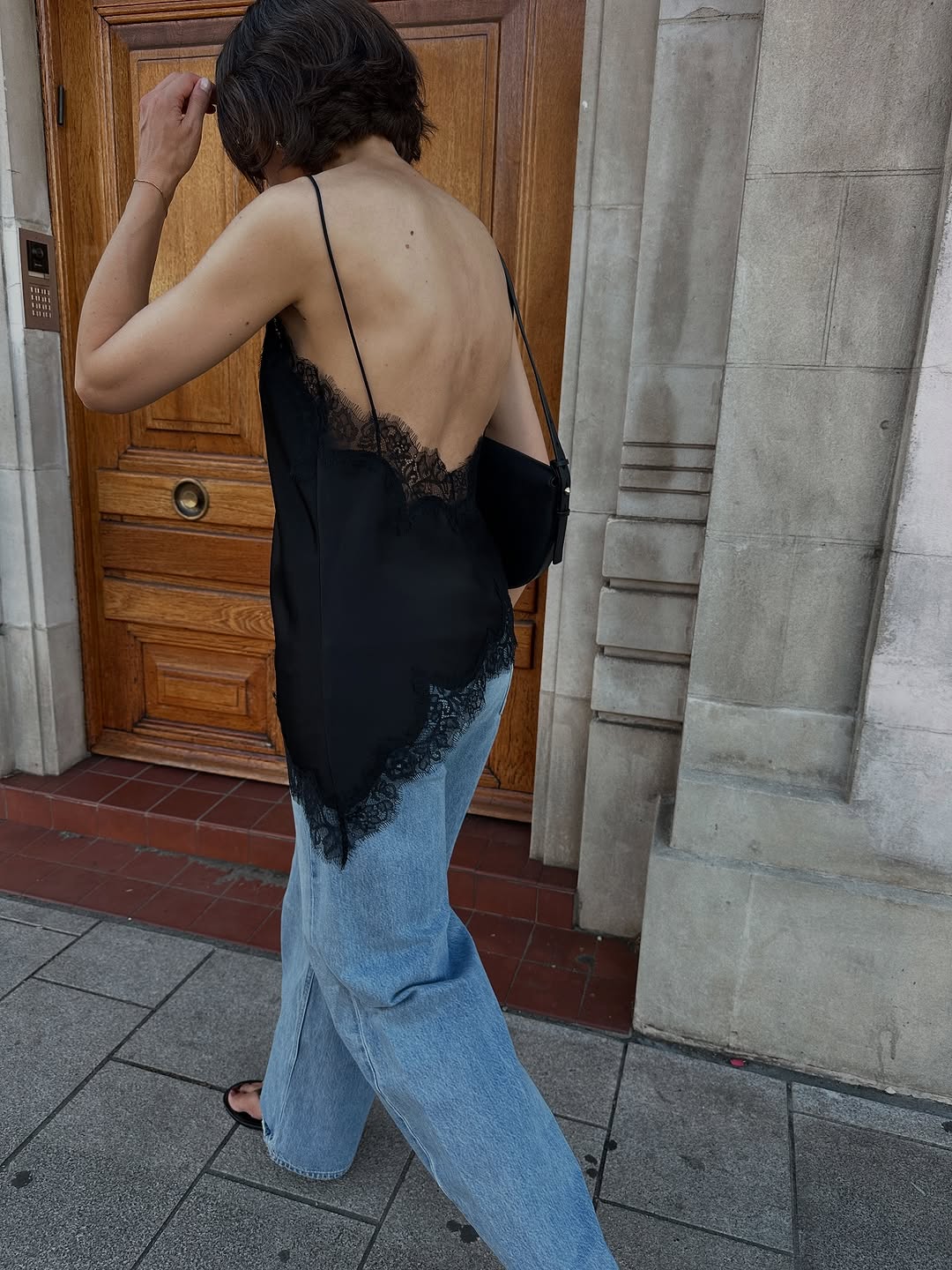 woman wearing black lace going out top outfit fall 2025