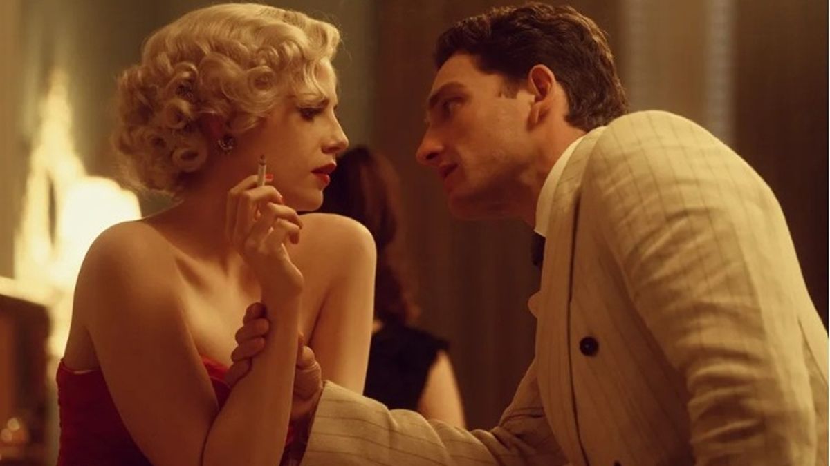 A glamorously dressed Lucy Boynton as Ruth Ellis, pictured in a fraught encounter with her volatile lover David Blakely, played by Laurie Davidson, in A Cruel Love: The Ruth Ellis Story.