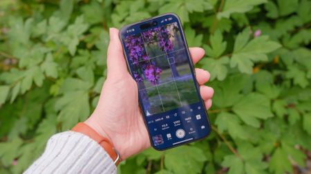 the Shutter Camera Remote App held in a person's hand