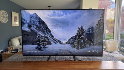 The Sony 65 Bravia 5 TV pictured on a wooden TV cabinet
