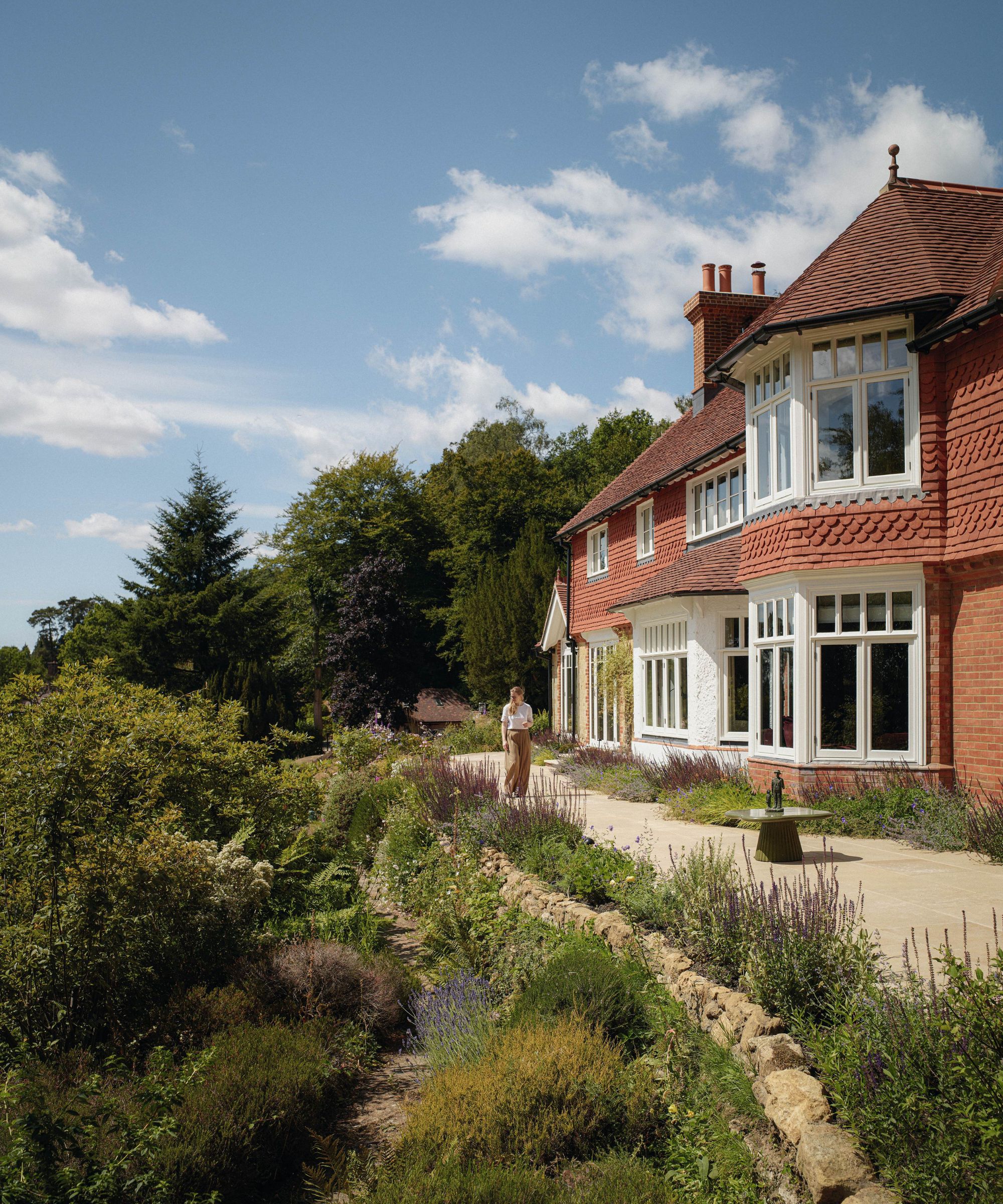 an arts and crafts style home perched atop the surrey hills