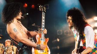 Slash (left) and Brian May perform at the Freddie Mercury Tribute Concert, Wembley Stadium, London, April 20, 1992.