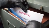 Thief stealing confidential documents