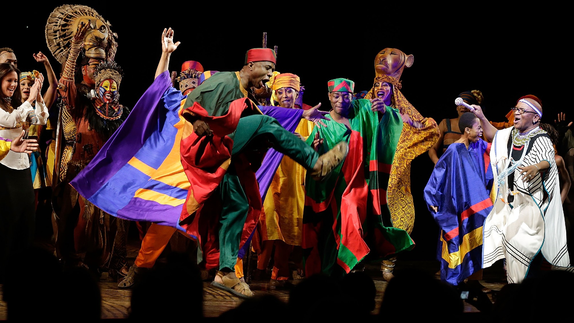 The cast of "The Lion King" on Broadway at the 15th Anniversary celebration at the Minskoff Theatre on November 18, 2012 in New York City