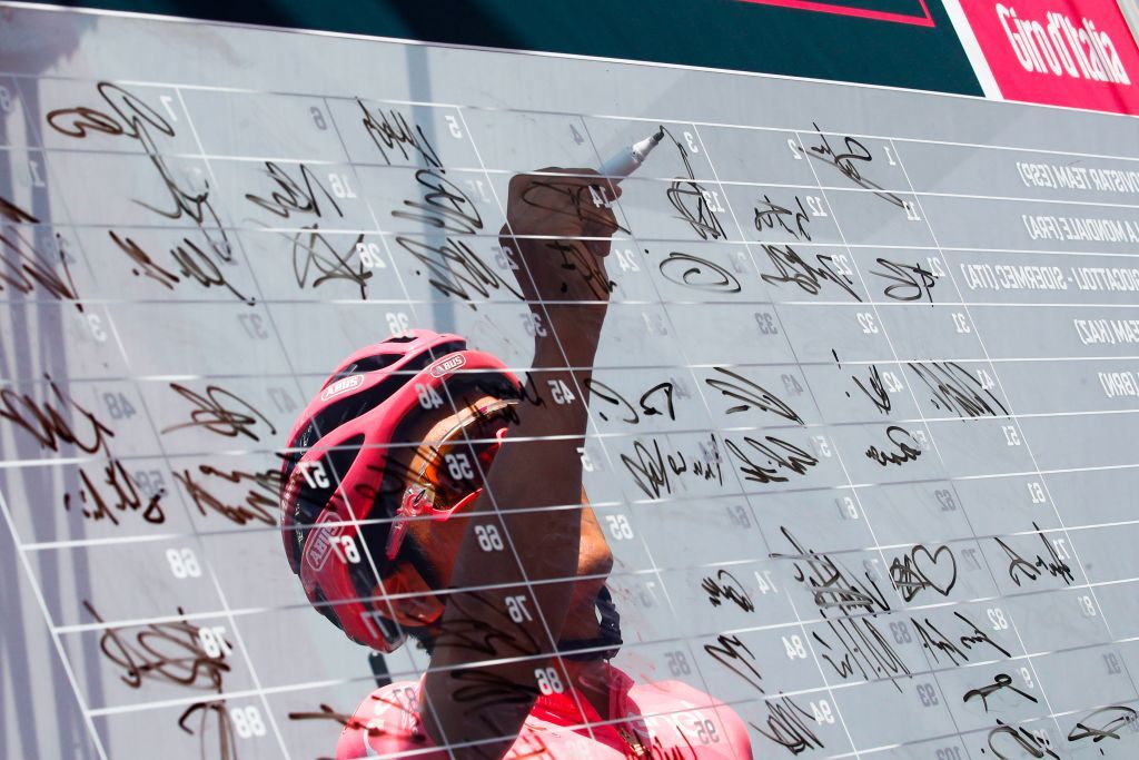 Richard Carapaz (Movistar) signs on at the start of stage 19 of the Giro d'Italia