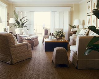 a living room with a natural sisal carpet