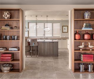 Wooden shelves, tile floor, grey kitchen island
