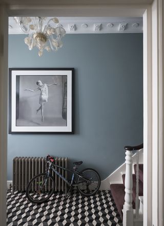 blue entryway with black radiator