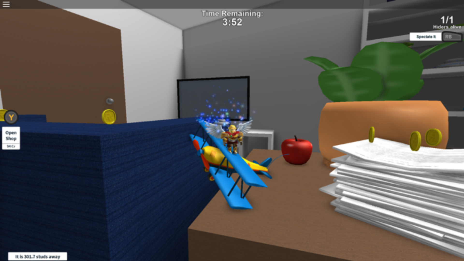 best Roblox games: a character hiding somewhere near a table that has a toy plane on it