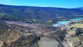 A photo of a landslide that has dammed a river