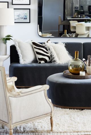 Monochrome room with white armchair,